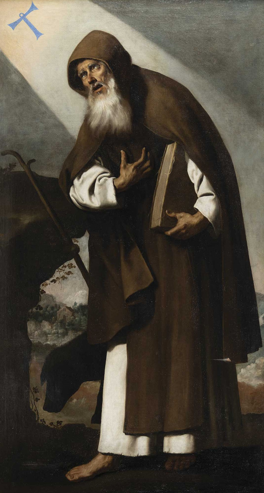 San Antonio abad, con barba blanca, encorvado, con el hábito marrón, mirando hacia la cruz de los hospitalarios, que baja del cielo, pintada hacia 1640 por Francisco de Zurbarán. Lo ofrece Abalarte con un precio de salida de salida de 550.000 euros